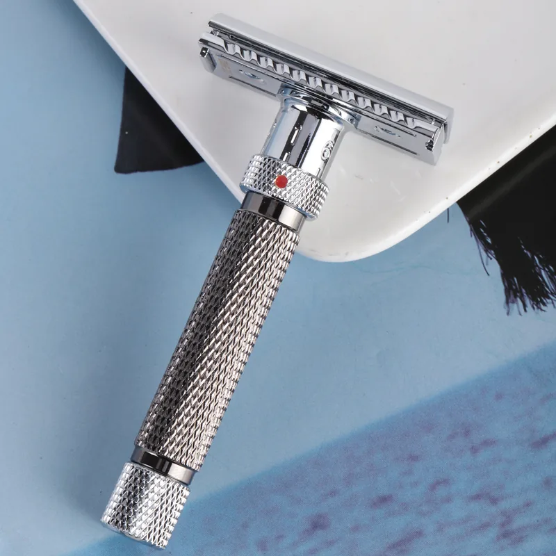 The Kelvedge safety razor laid on its side, showing the chrome head, the numbered collar with its red index mark, and the knurled brass handle